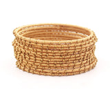Thread Bangles Set of 12 with golden bearing by Leshya