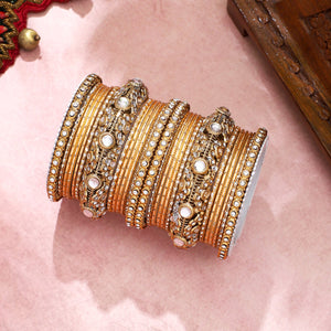 Luxurious Golden dotted and Jaaliwork bangle set by Leshya