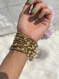 Set of 8 Golden Ghungroo Bangles with Golden Stone by Leshya