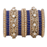 Luxurious Golden dotted and Jaaliwork bangle set by Leshya
