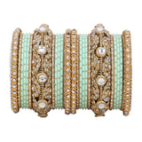 Luxurious Golden dotted and Jaaliwork bangle set by Leshya