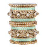 Luxurious Golden dotted and Jaaliwork bangle set by Leshya