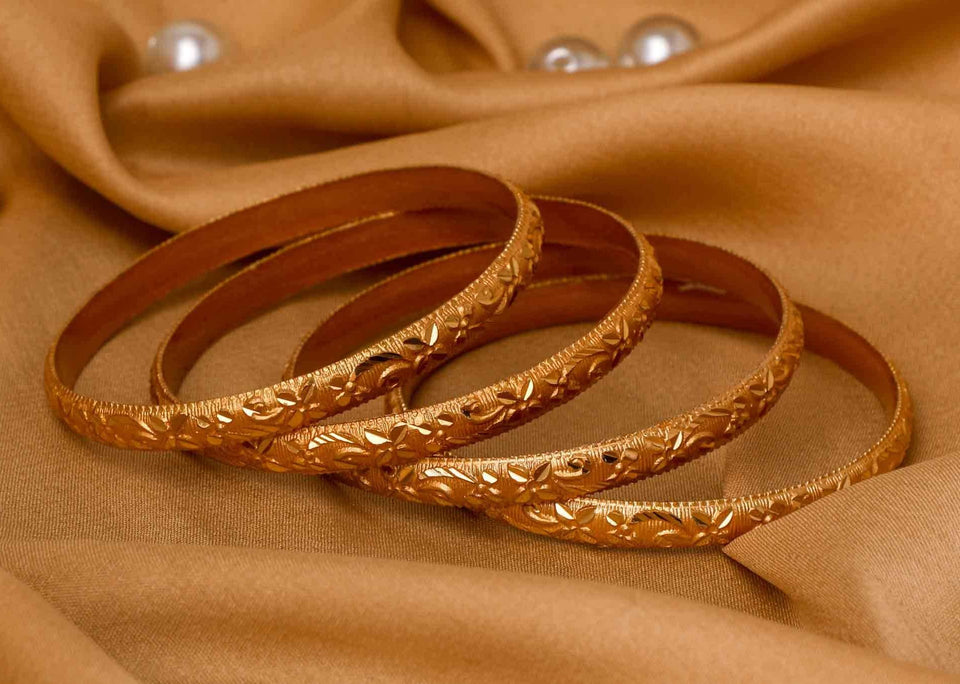 Set Of 4 Gold Dyed Bracelets With Delicate Flower Patterns