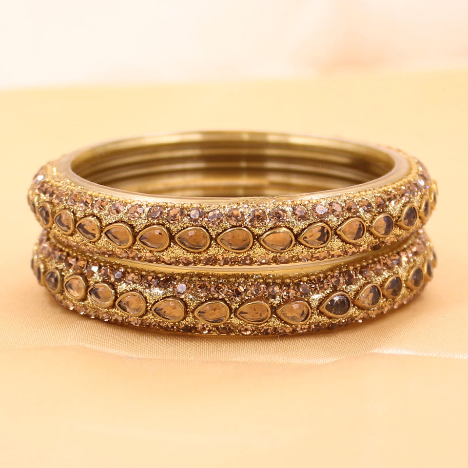 Pair of Golden Running Kundan Glass Bangles by Leshya