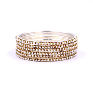 Brass Based Bangles with Running White Bead by Leshya