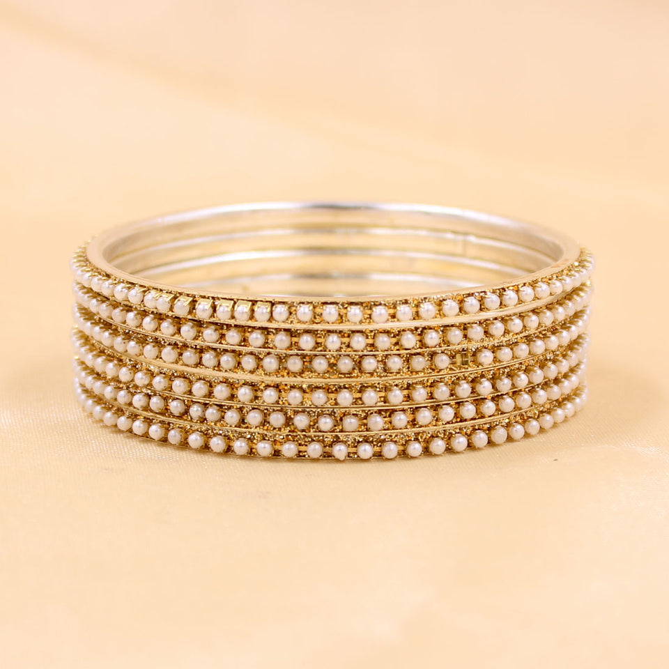 Brass Based Bangles with Running White Bead by Leshya
