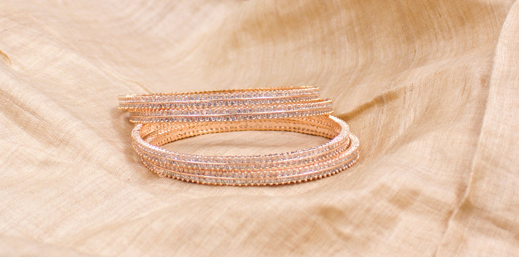 Beautiful Set of 4 Rose-Gold Running stone Bracelets by Leshya